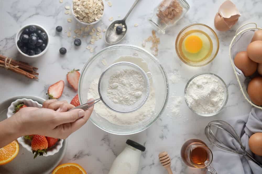 Dry Ingredients being sifted with other baking ingredients including Instant Clear Jel or Clearjel