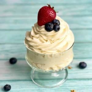 A serving dish filled with stabilized whipped cream that's been piped with a star tip