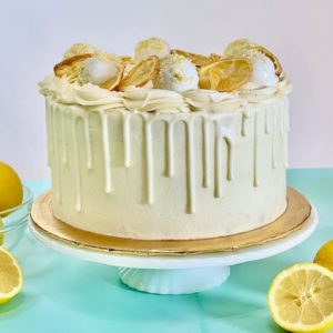 Decorated Lemon cake with lemon cake truffles and sugared lemon slices