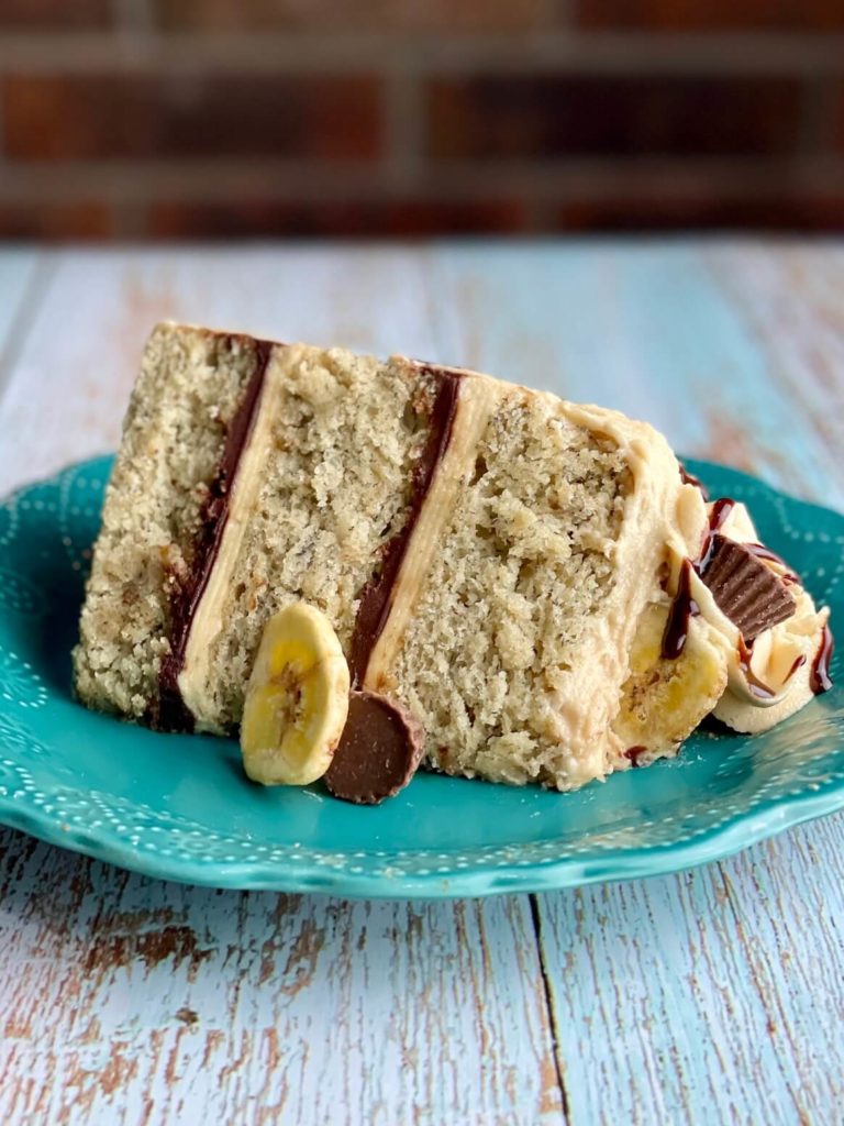 elvis cake slice of banana cake with chocolate filling and peanut butter frosting