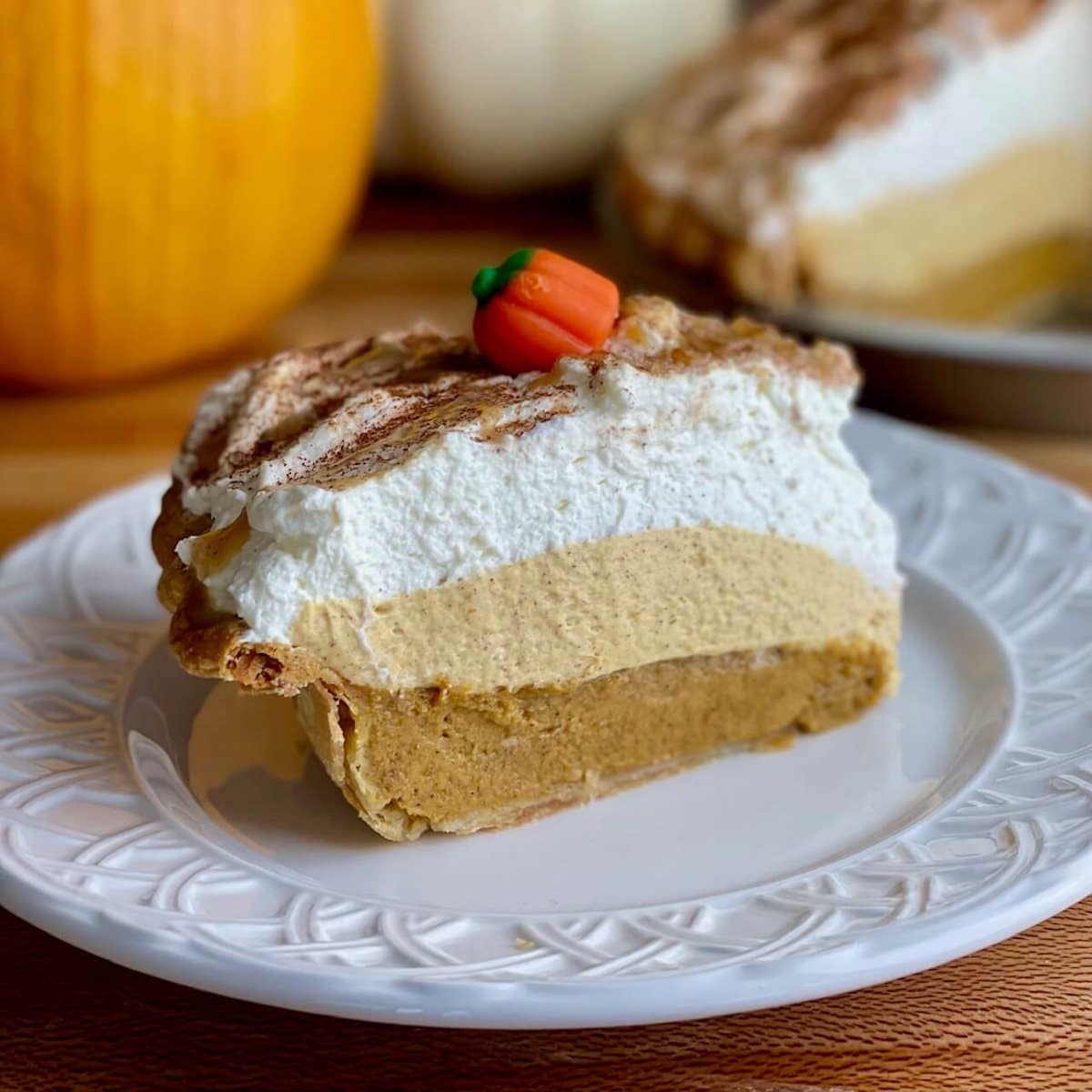 https://amycakesbakes.com/wp-content/uploads/2021/11/Slice-of-Triple-Layer-Pumpkin-Pie.jpg