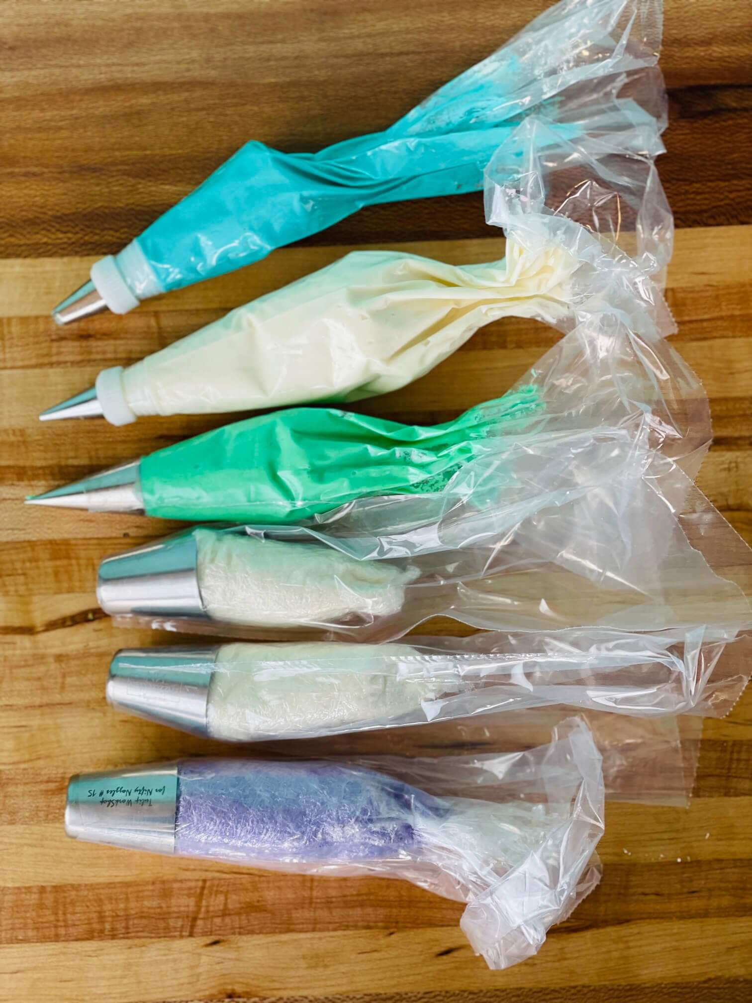Buttercream piping bags for a princess flower cake with russian flower piping tips