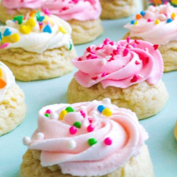 Mini sugar cookies frosted with a buttercream swirl