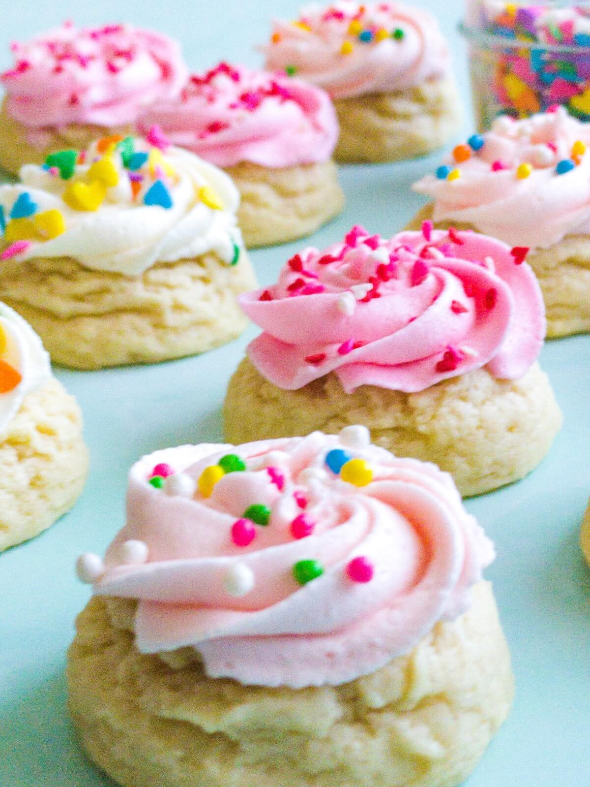 Mini sugar cookies frosted with a buttercream swirl