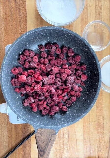 Frozen raspberries in a skillet