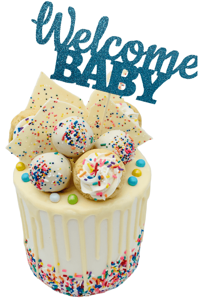 white ganache drizzle cake with welcome baby banner