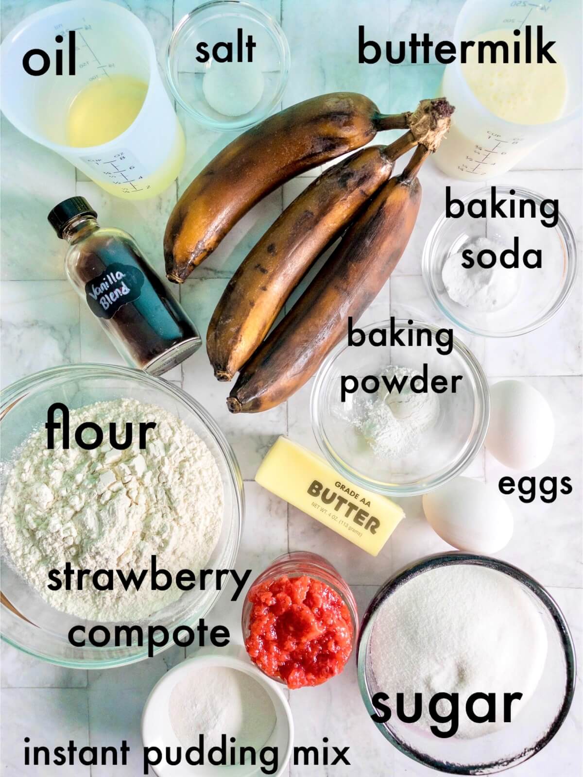 an overhead shot of all the strawberry banana cake recipe ingredients