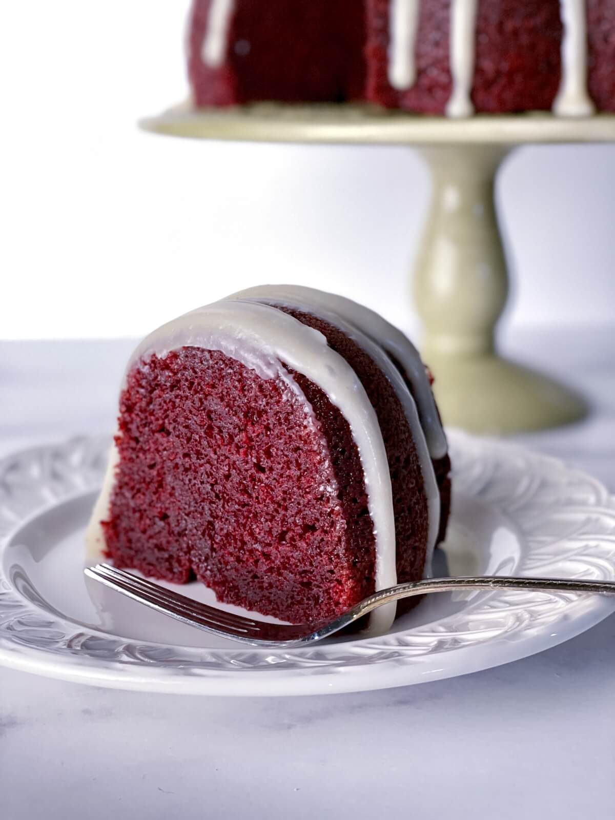 A slice of very moist red velvet bundt cake