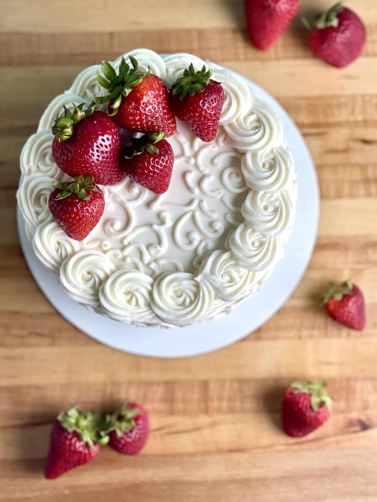 An overhead shot of strawberry vanilla layer cake.