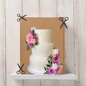 A tall cardboard box with scissors lines showing to cut along the front sides to create a door to place a tiered wedding cake, with an image of a wedding cake in front of it.