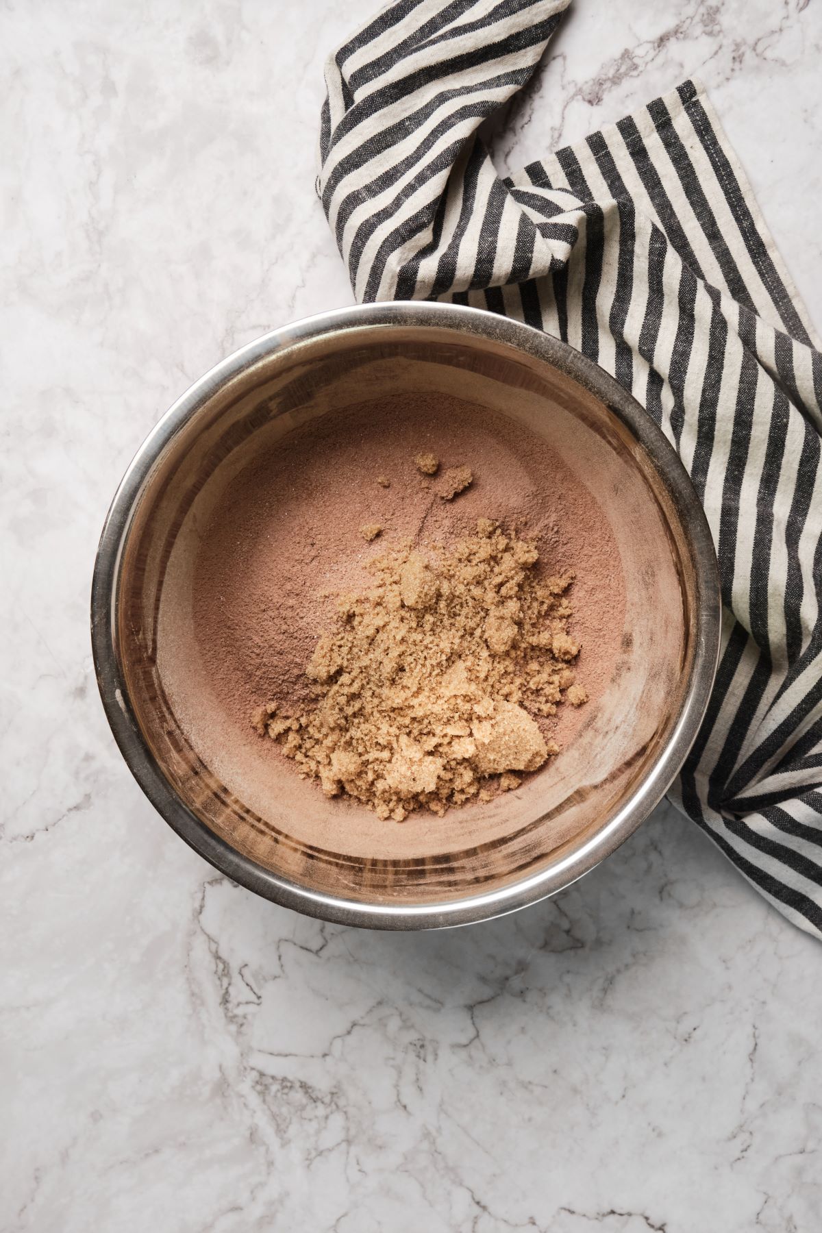 A bowl of dry ingredients for chocolate cake.