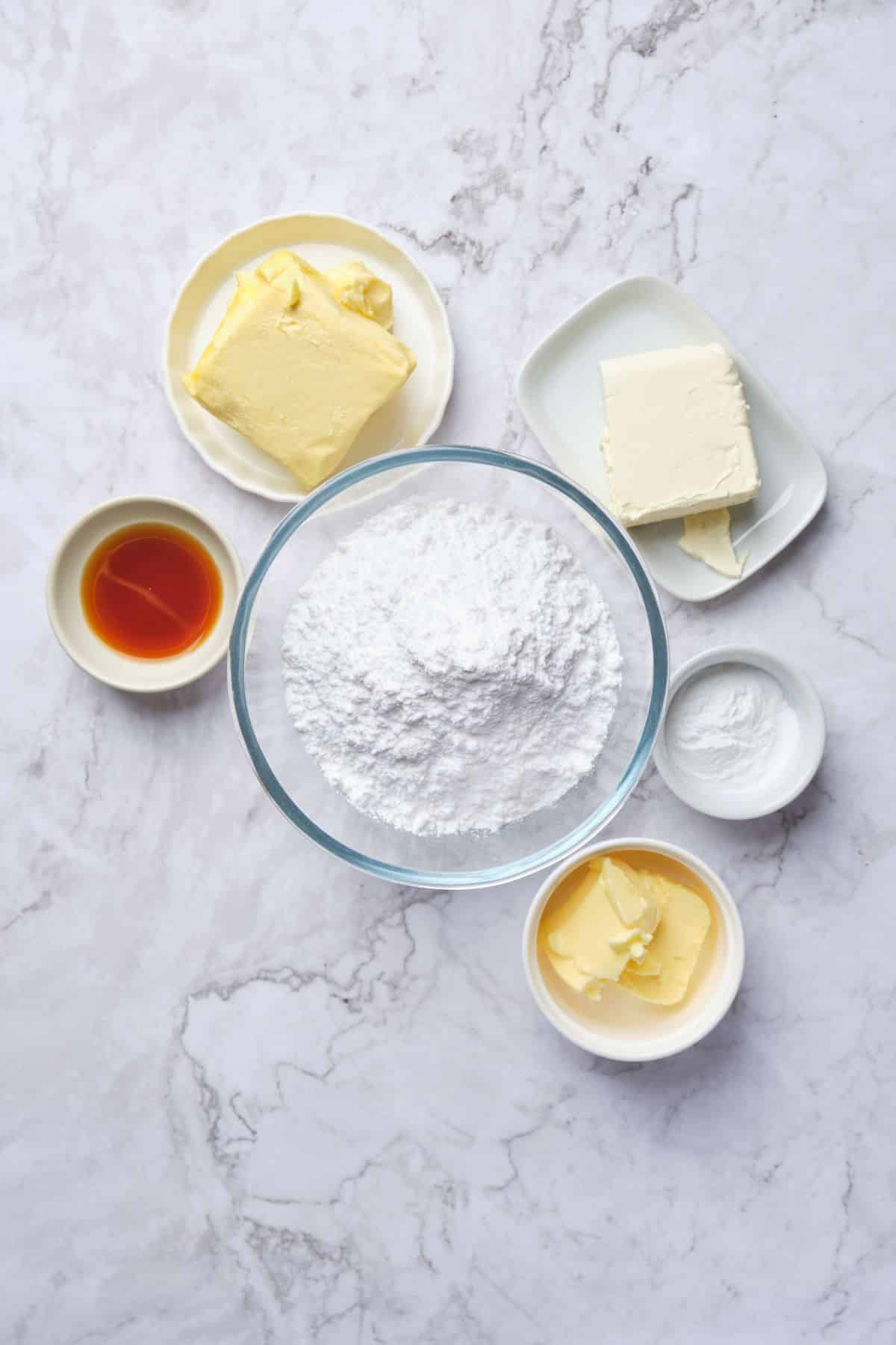 An overhead shot of vanilla cream cheese buttercream ingredients.