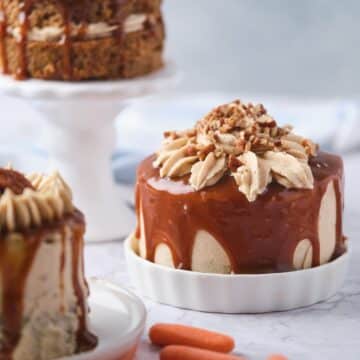 Decorated miniature carrot cakes with caramel drizzle and cinnamon buttercream.