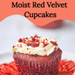 A very moist red velvet cupcake with the wrapper off and cream cheese buttercream frosting with a red velvet crumb topping and the text "the best moist red velvet cupcakes" and "amycakesbakes.com"
