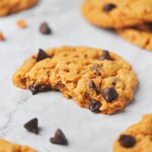 A butterscotch chocolate chip cookies cut open showing the soft and chewy texture.