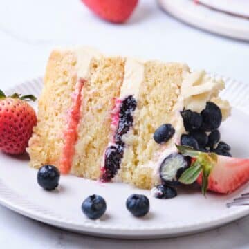 A layer cake with blueberry cake filling and strawberry cake filling.