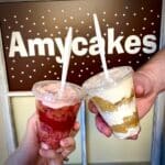 image of two cake cup parfaits in front of Amycakes banner.