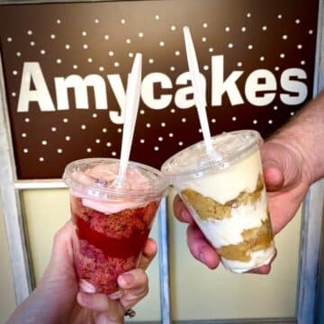 image of two cake cup parfaits in front of Amycakes banner.