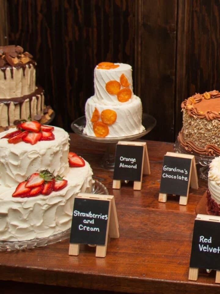 table with several different wedding cake flavors and recipes.