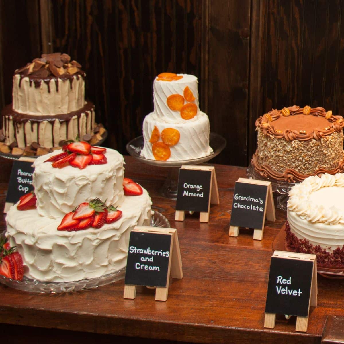 table with several different wedding cake flavors and recipes.