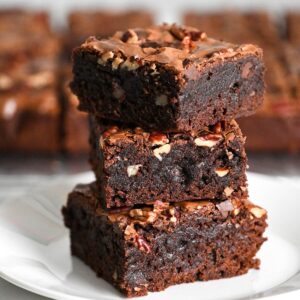 stacked bakery style brownies made with boxed mix and special ingredients.