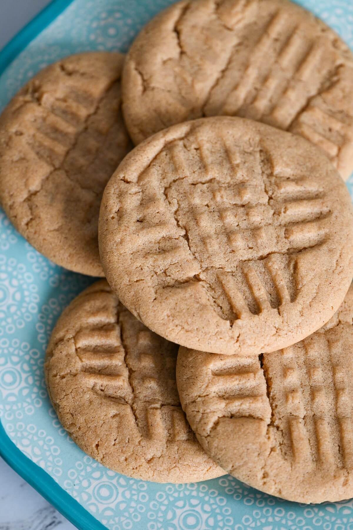 A plate of soft and chewy peanut butter cinnamon cookies.