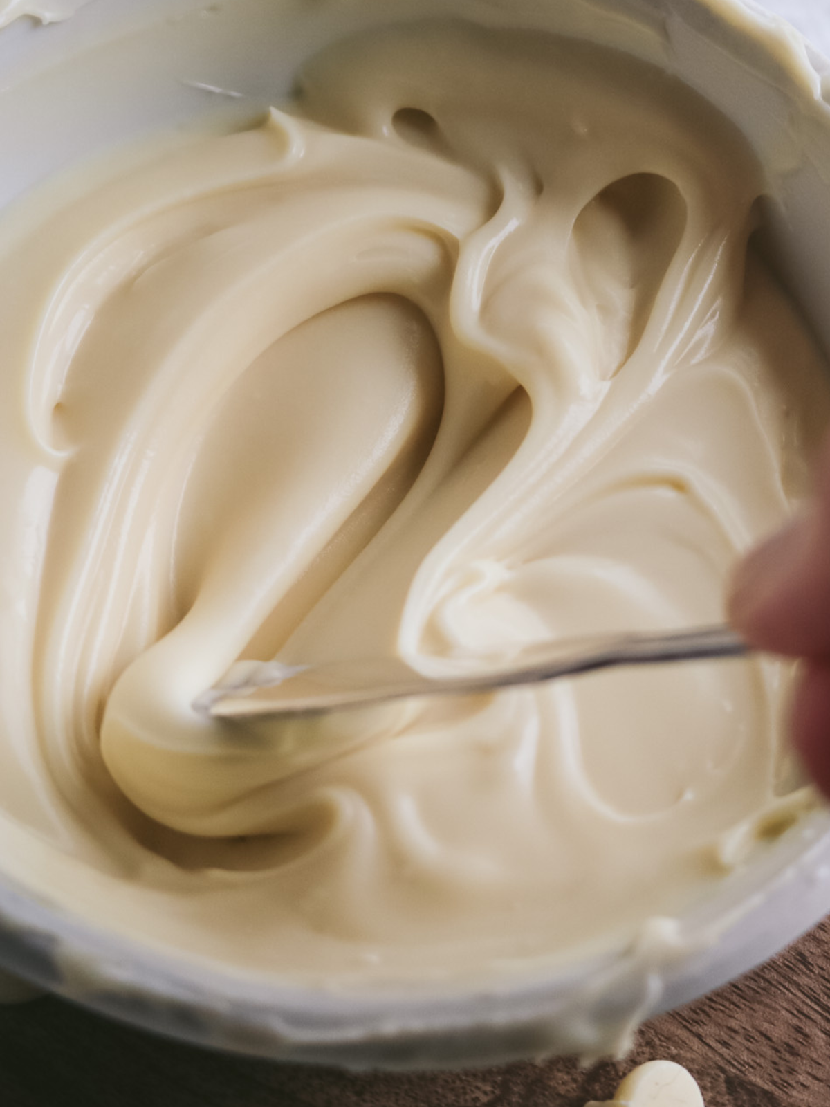 close up view of thick white chocolate ganache from the fridge.