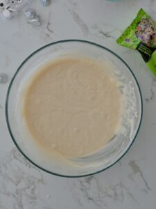 A bowl of smooth vanilla cupcake batter.