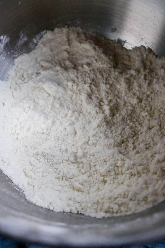 dry ingredients for cupcakes with the butter mixed in until the mixture looks sandy.