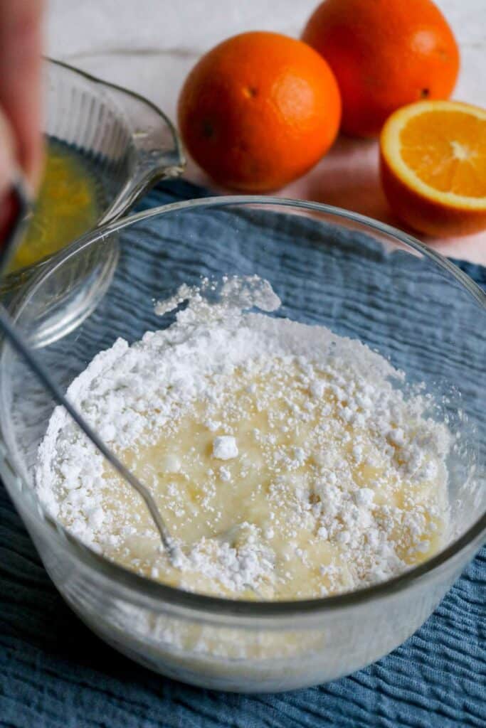 whisking together ingredients for orange glaze.